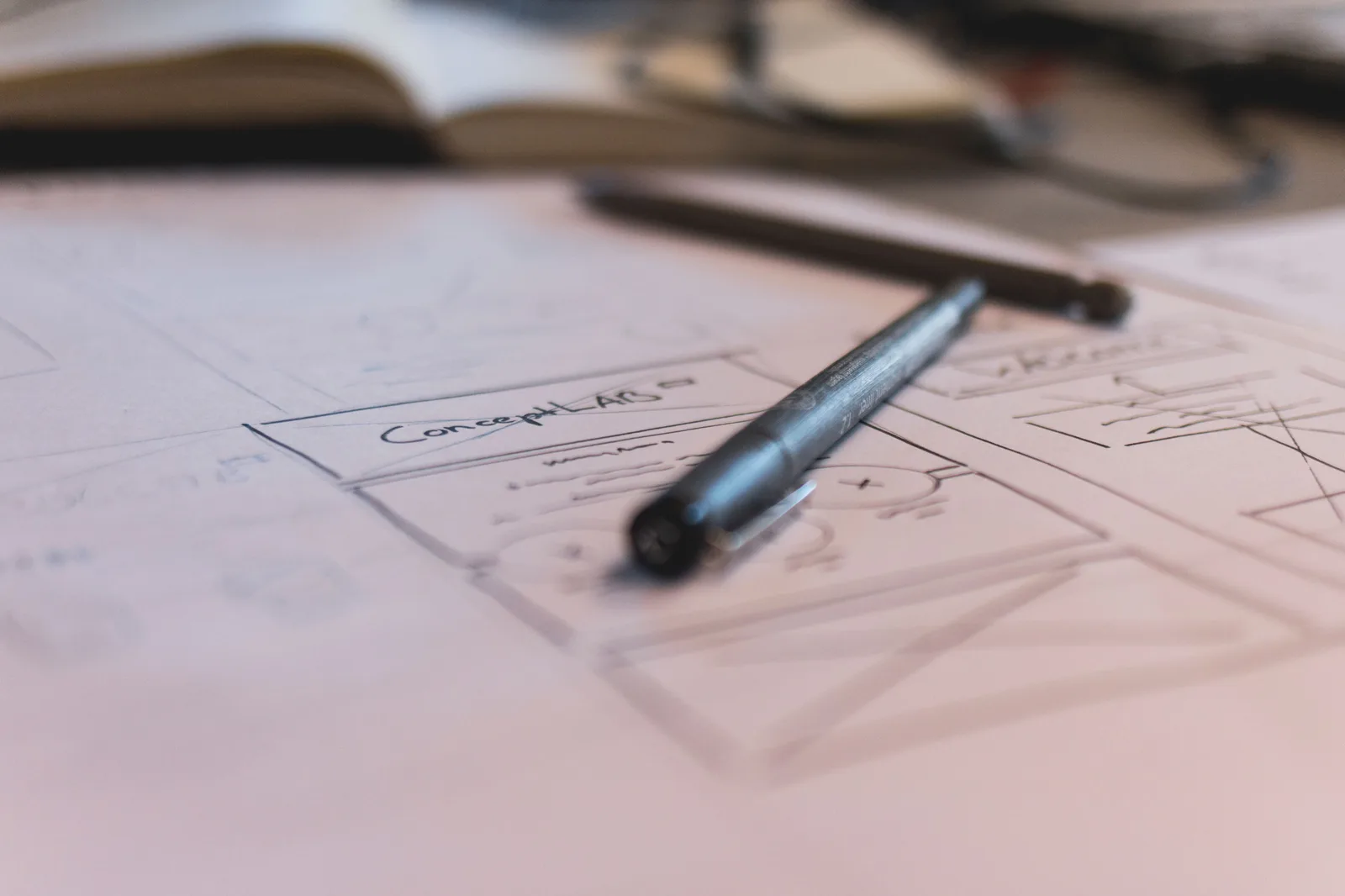 A sketch with notes and a pen on paper. Ideal for planning or design concepts. Product marketing strategy: the version that survives contact with reality